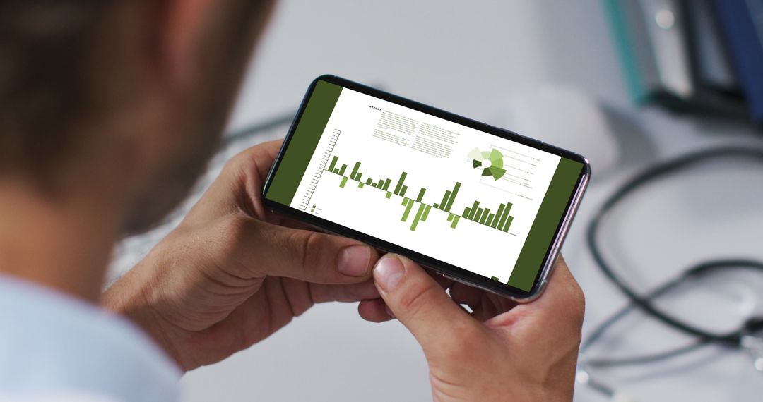 Man Analyzing Business Statistics on Smartphone Close-up