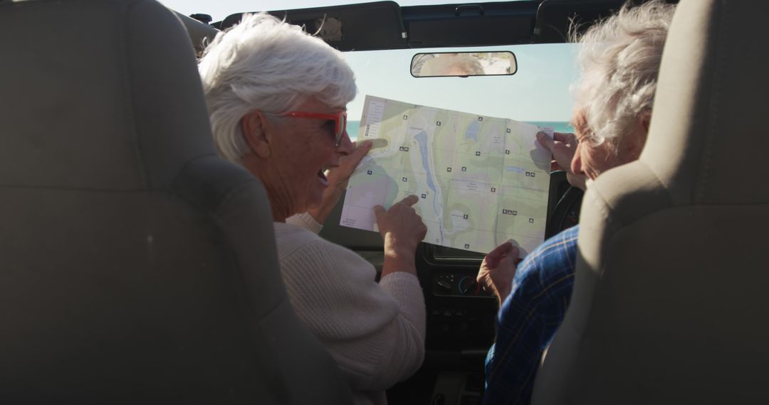 Senior Couple on Road Trip Navigating with Map Inside Car - Free Images, Stock Photos and Pictures on Pikwizard.com