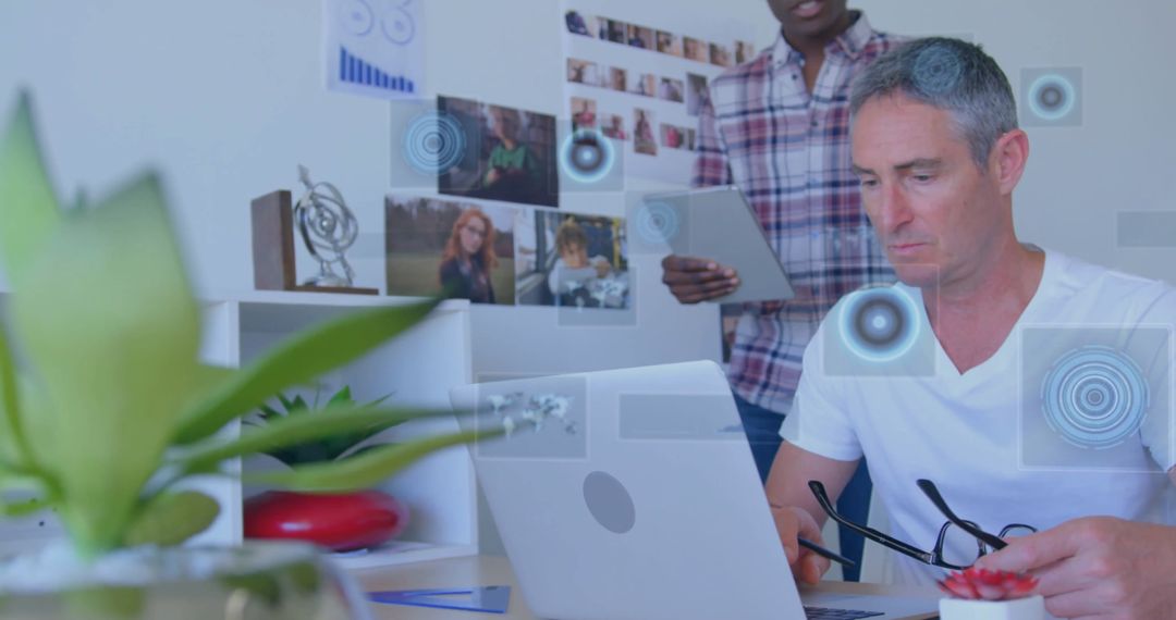 Office Workers Collaborating and Using Modern Technology at Desk