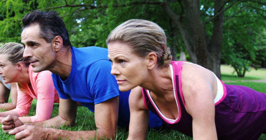 Diverse Group Engaging in Outdoor Plank Exercise