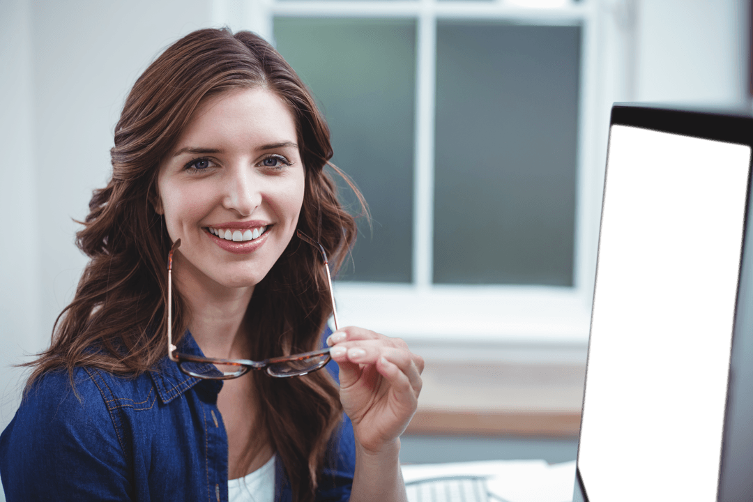 Transparent Happy Woman Holding Glasses at Computer Desk