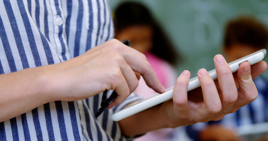 Person Using Tablet with Stylus in Classroom - Free Images, Stock Photos and Pictures on Pikwizard.com