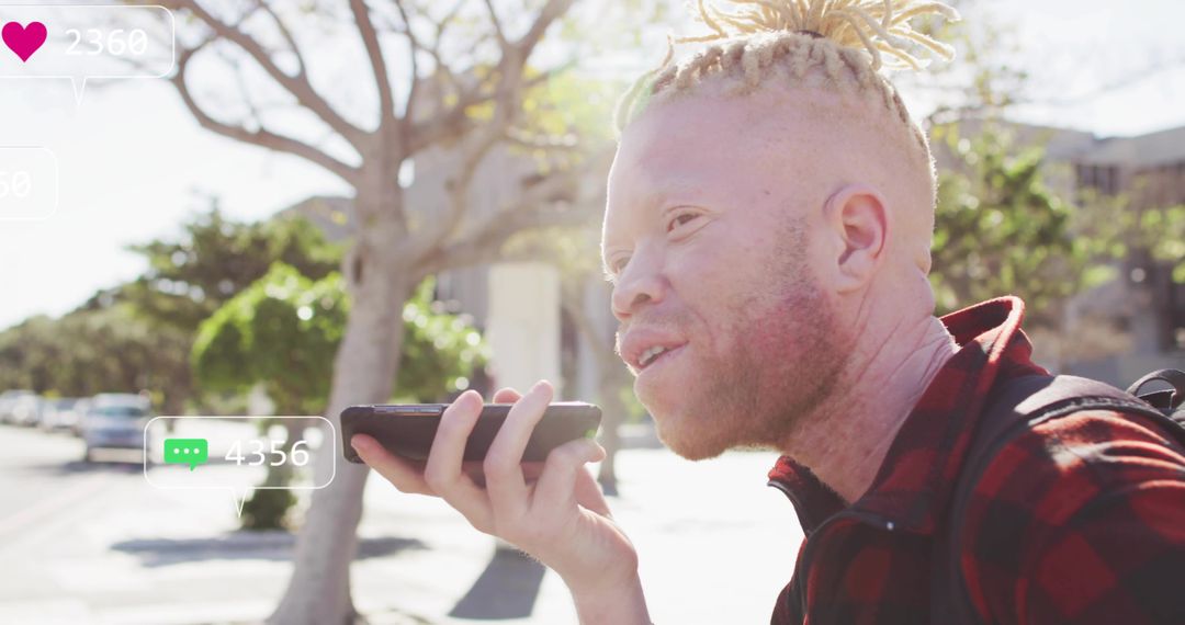Young Man Engaging with Technology in Urban Setting