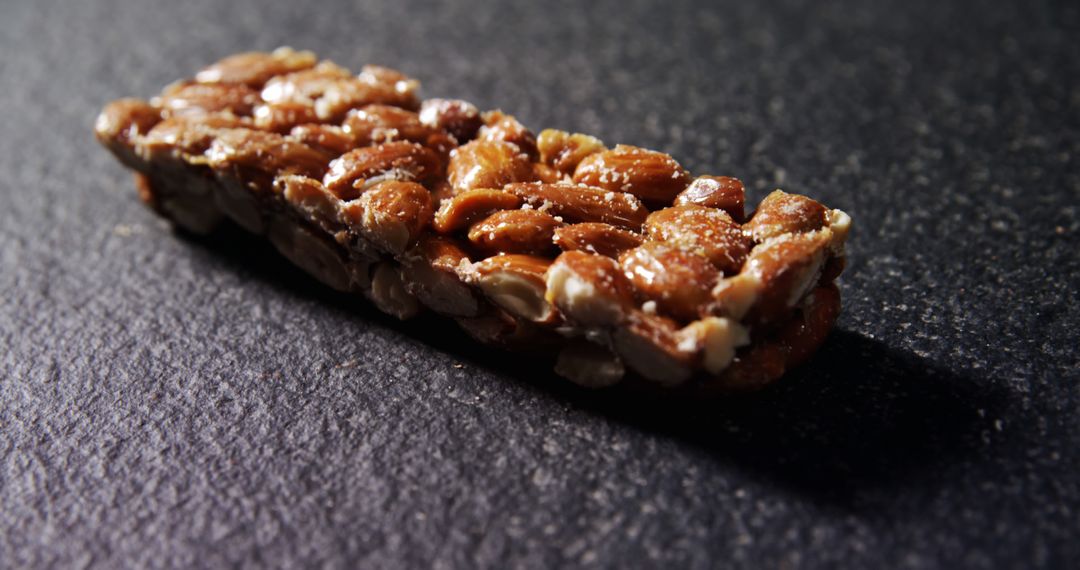 Granola Bar with Nuts on Dark Background - Free Images, Stock Photos and Pictures on Pikwizard.com