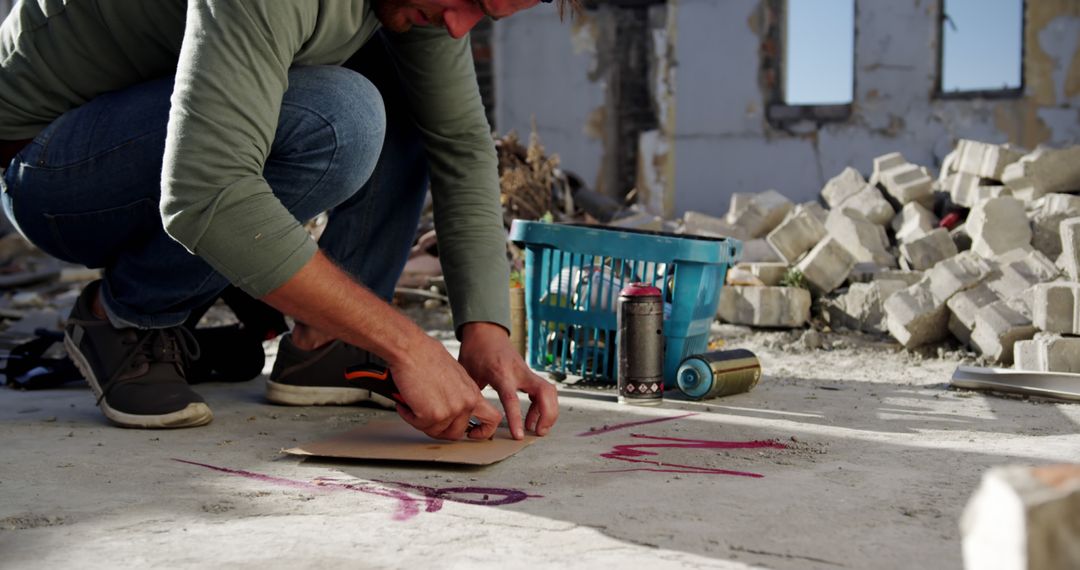 Street Artist Sketching Design in Abandoned Building - Free Images, Stock Photos and Pictures on Pikwizard.com