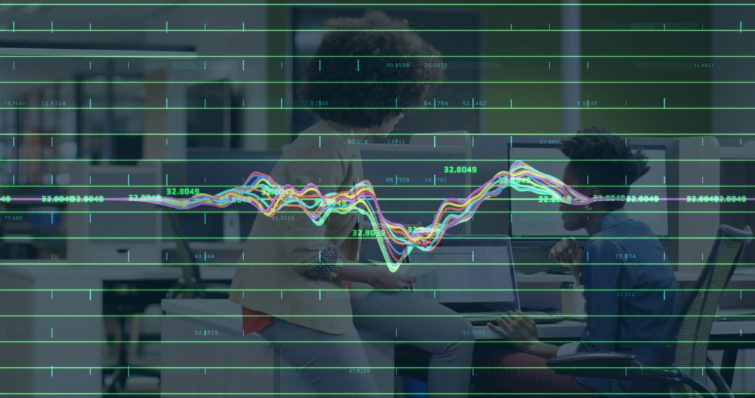 Businesswomen Analyzing Financial Data with Line Graph Overlay - Free Images, Stock Photos and Pictures on Pikwizard.com