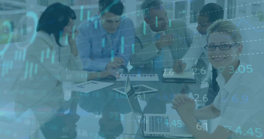 Business Team Analyzing Data with Laptops in Meeting Room
