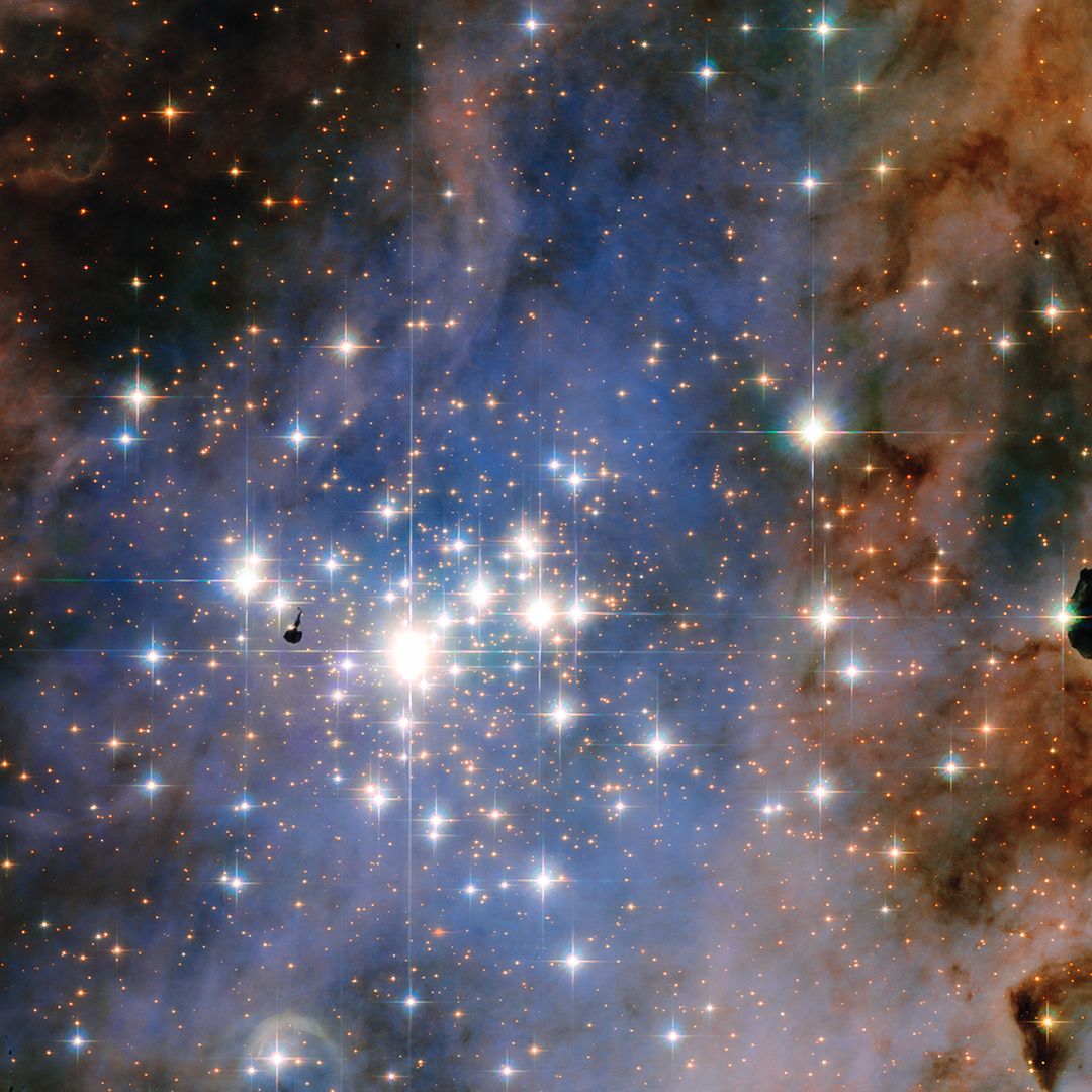 Glittering Star Cluster Trumpler 14 in Carina Nebula - Free Images, Stock Photos and Pictures on Pikwizard.com