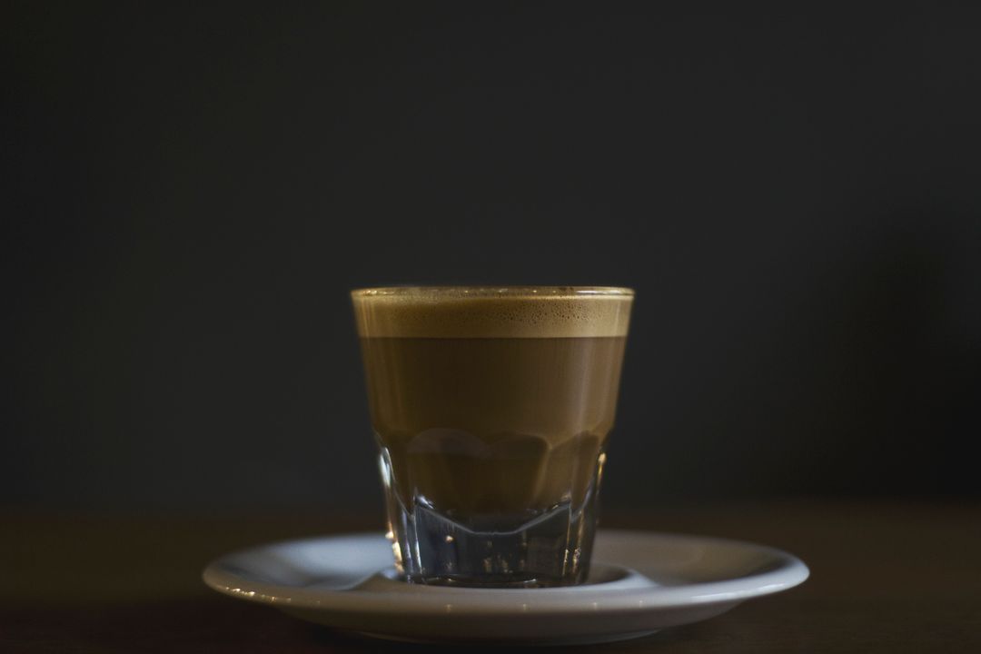 Freshly Brewed Cortado Coffee in Glass Cup on Dark Background - Free Images, Stock Photos and Pictures on Pikwizard.com