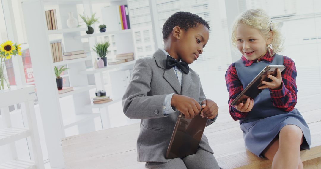 Children in Formal Attire Interacting with Tablets in Modern Office - Free Images, Stock Photos and Pictures on Pikwizard.com