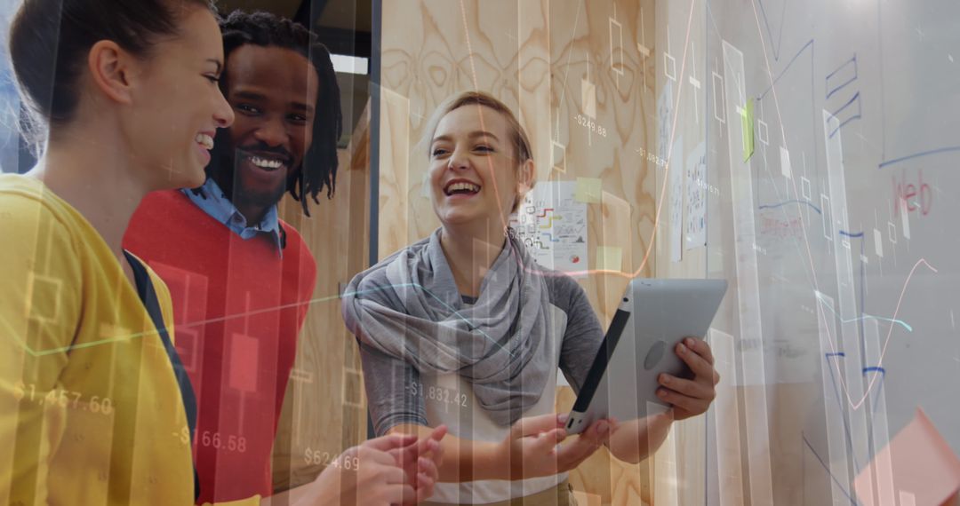 Team Collaborating on Financial Data Visualization with Technology