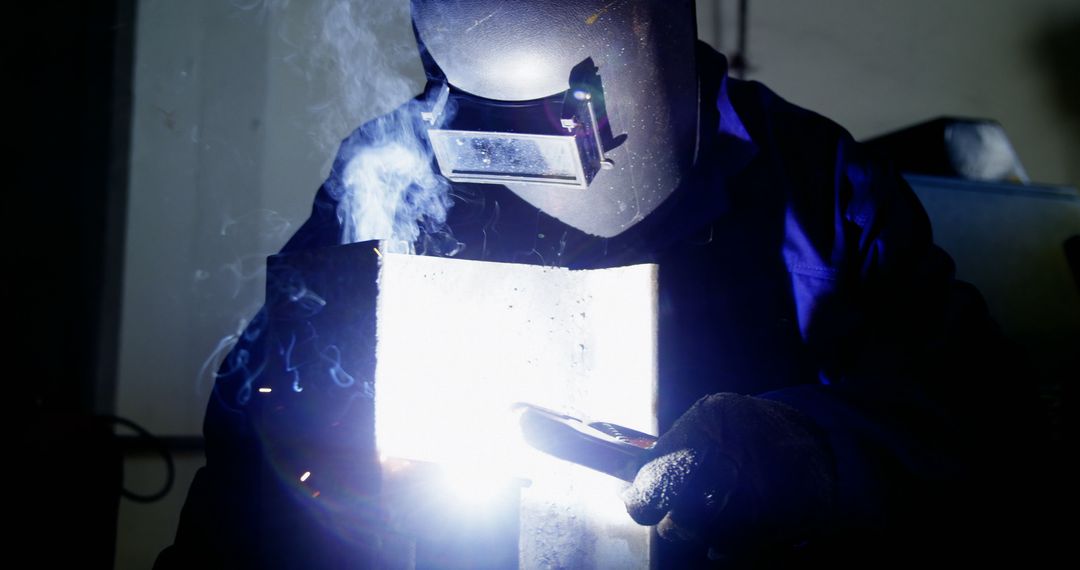 Industrial Welder in Protective Gear Working with Metal - Free Images, Stock Photos and Pictures on Pikwizard.com