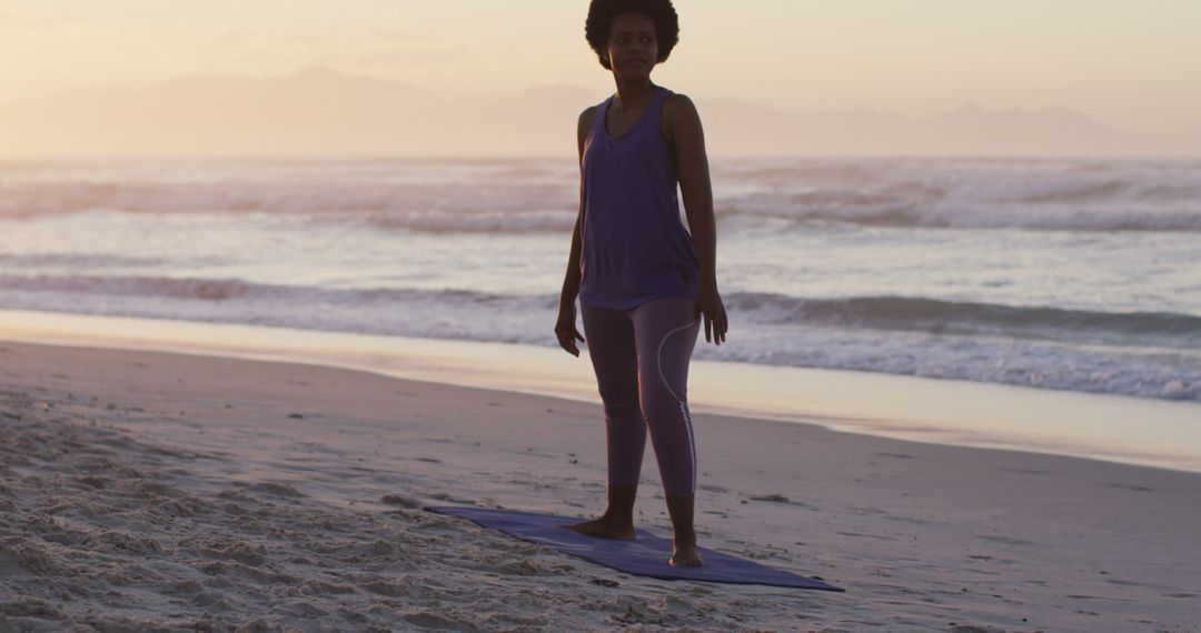 Woman Practicing Yoga on Beach During Sunset - Free Images, Stock Photos and Pictures on Pikwizard.com
