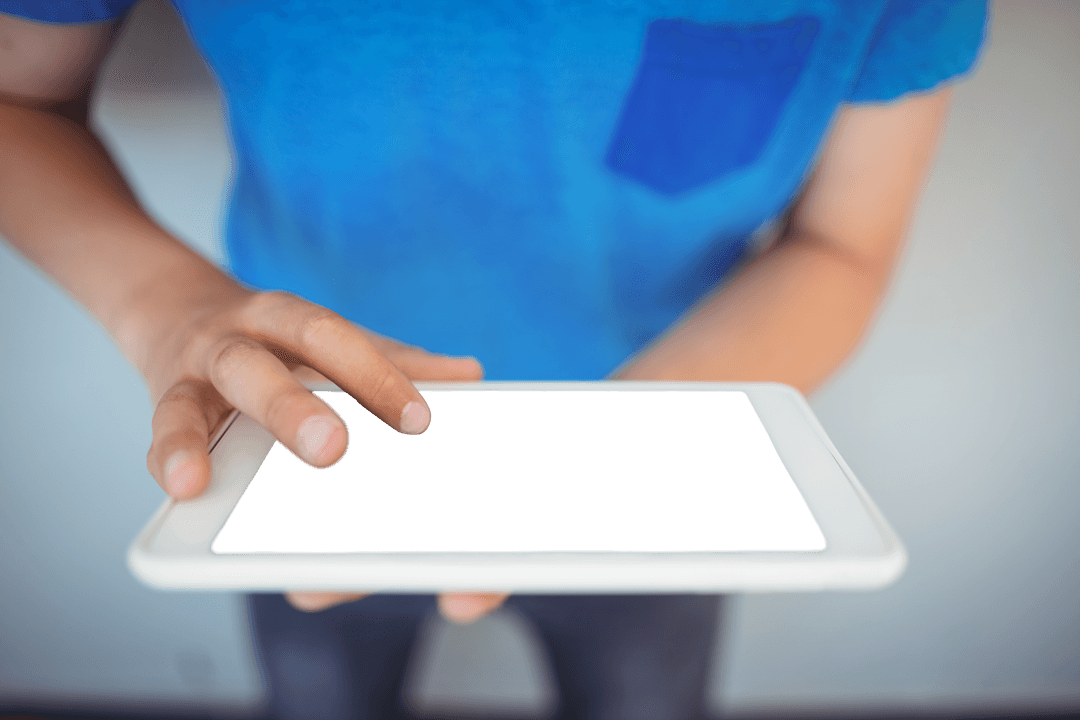 Close-Up of Schoolboy Using Transparent Tablet Education Technology