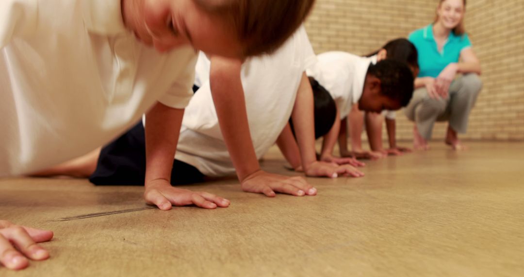 Diverse Group of Children Exercising and Doing Push-Ups - Free Images, Stock Photos and Pictures on Pikwizard.com