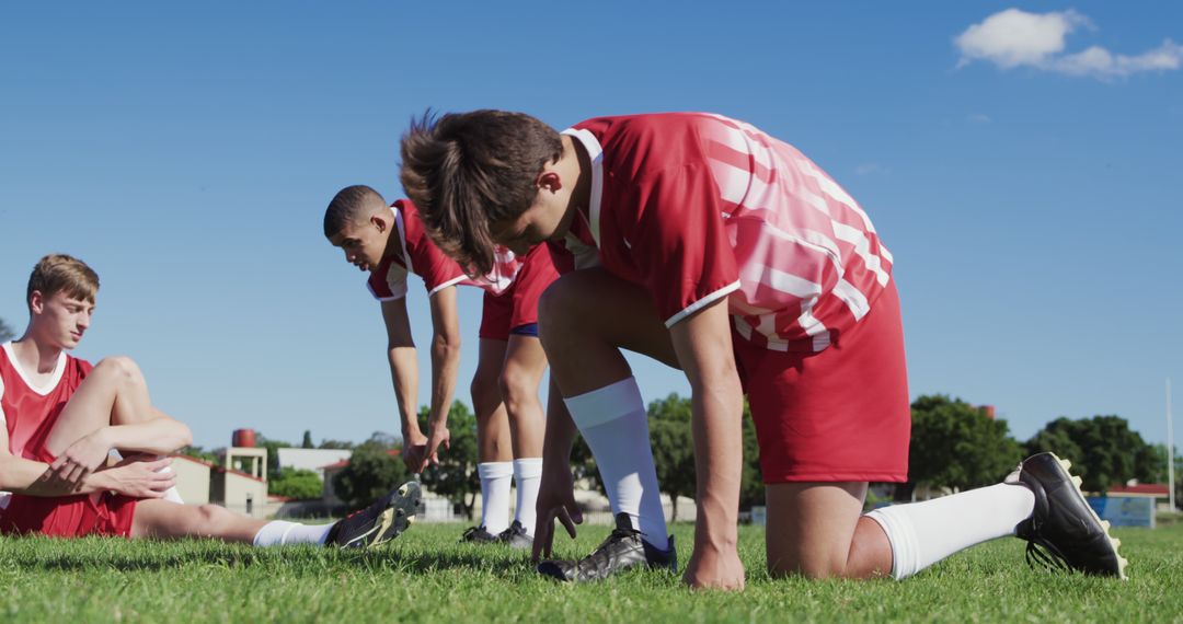 Youth Soccer Players Stretching on Field Before Practice Session - Free Images, Stock Photos and Pictures on Pikwizard.com