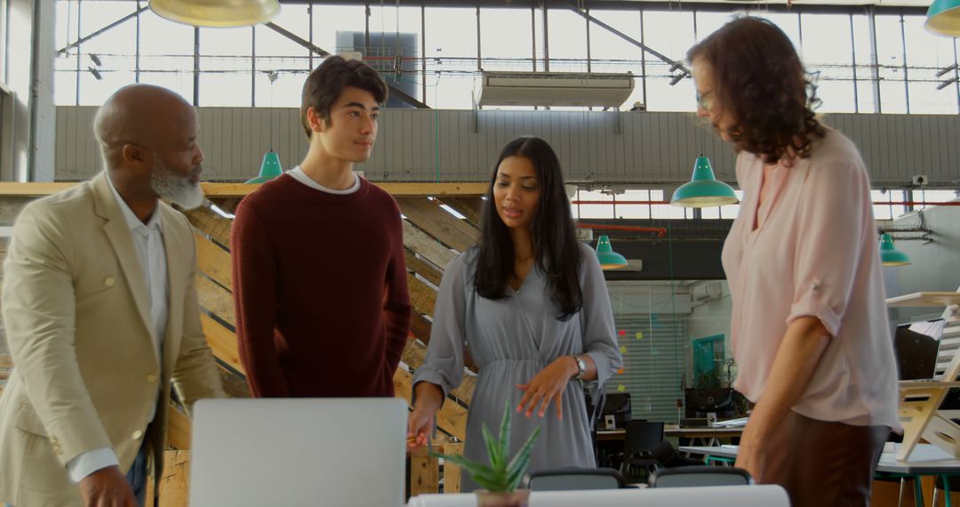 Diverse Team Collaborating in Modern Office on Innovative Project