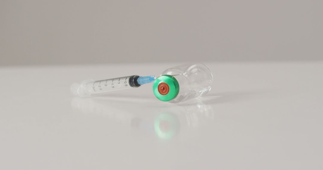 Syringe with vaccine vial on white background - Free Images, Stock Photos and Pictures on Pikwizard.com