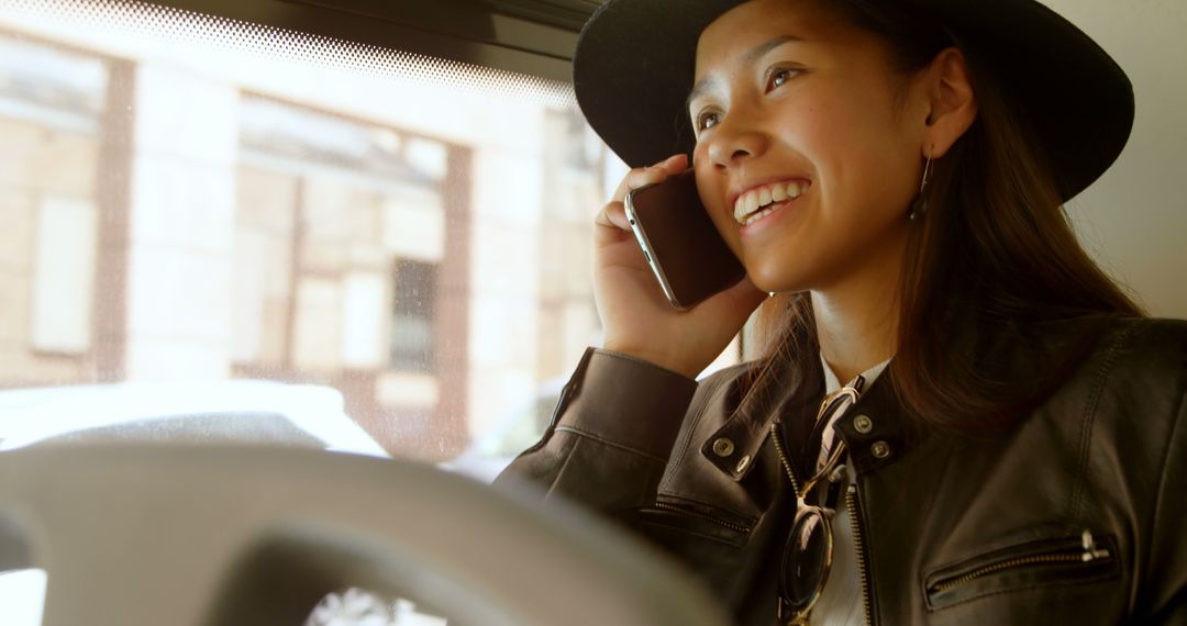 Woman Smiling While Talking on Phone during Commute - Free Images, Stock Photos and Pictures on Pikwizard.com