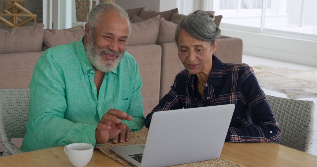 Senior Couple Engaging with Technology in Home Setting