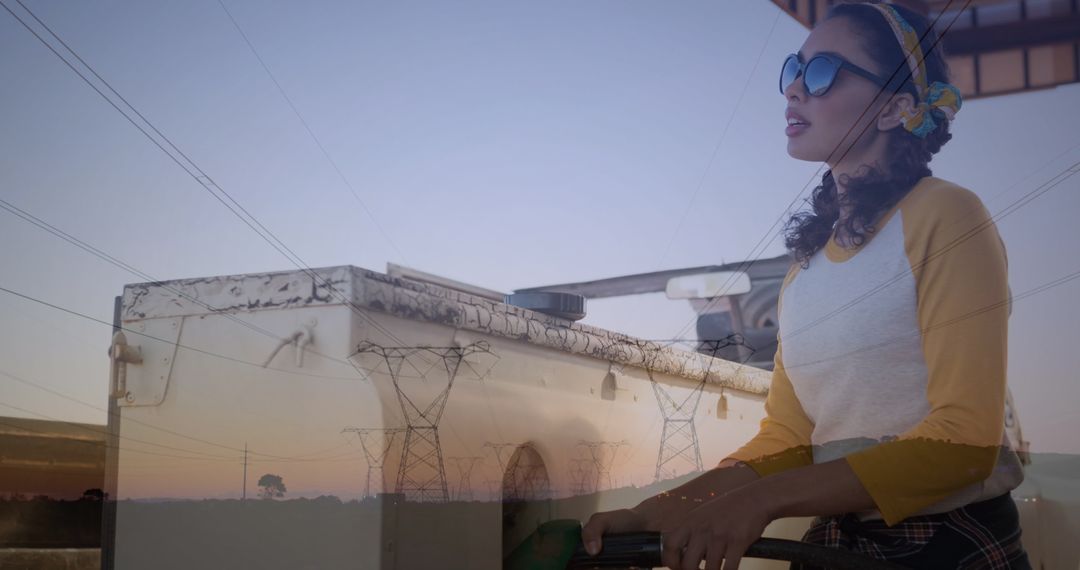Conceptual Image of Woman Refueling Car Overlapped with Power Lines