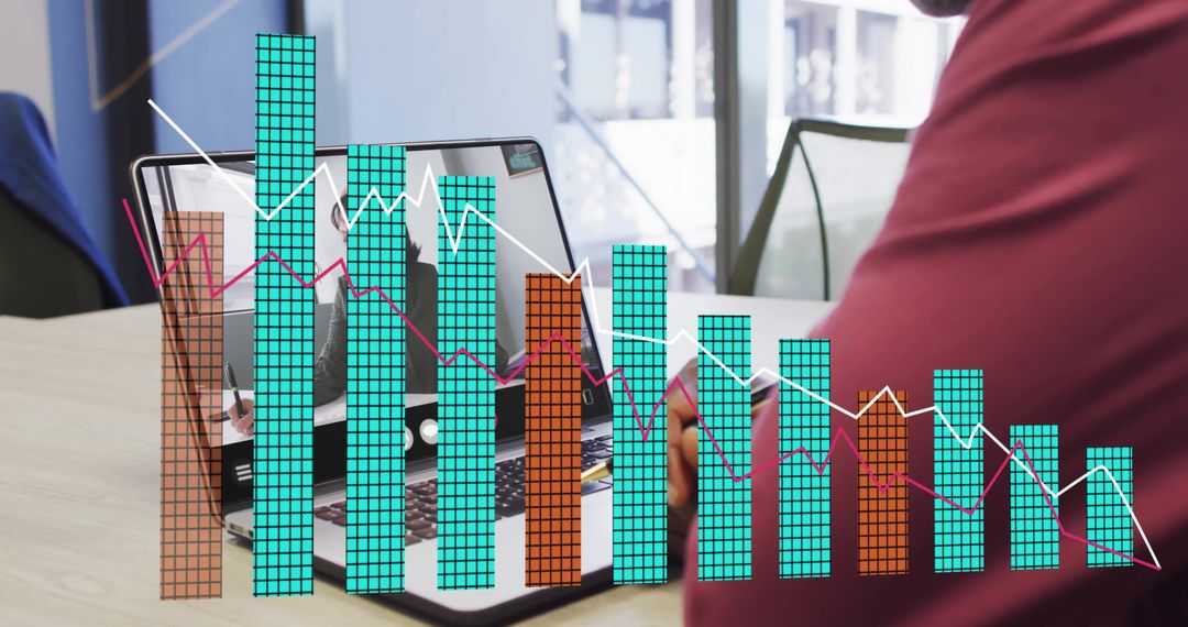 Man Analyzing Financial Data on Laptop in Modern Workspace