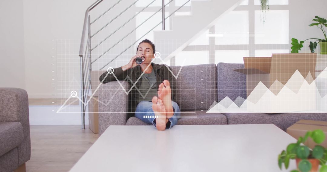 Woman Relaxing While Analyzing Financial Data Graphs in Modern Home