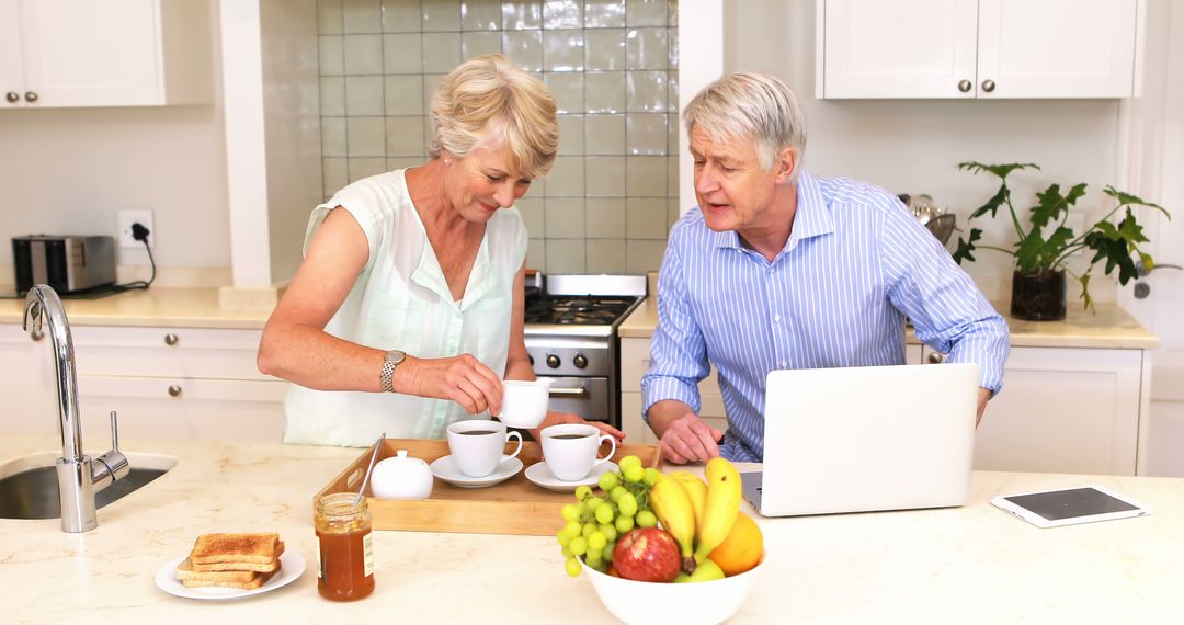 Senior Couple Preparing Morning Coffee in Bright Kitchen - Free Images, Stock Photos and Pictures on Pikwizard.com