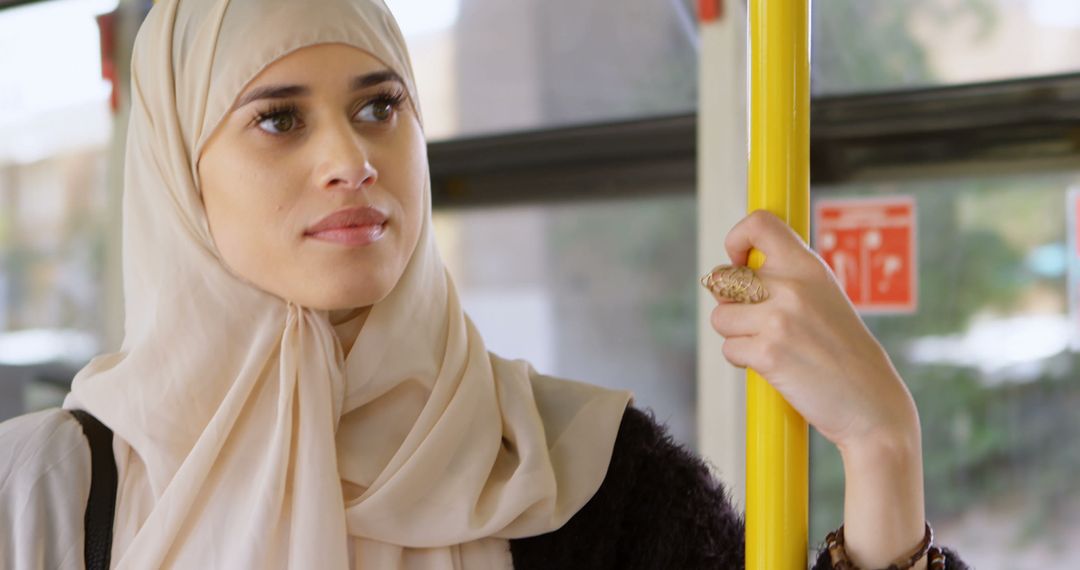 Muslim Woman Wearing Hijab Traveling on Public Transport - Free Images, Stock Photos and Pictures on Pikwizard.com