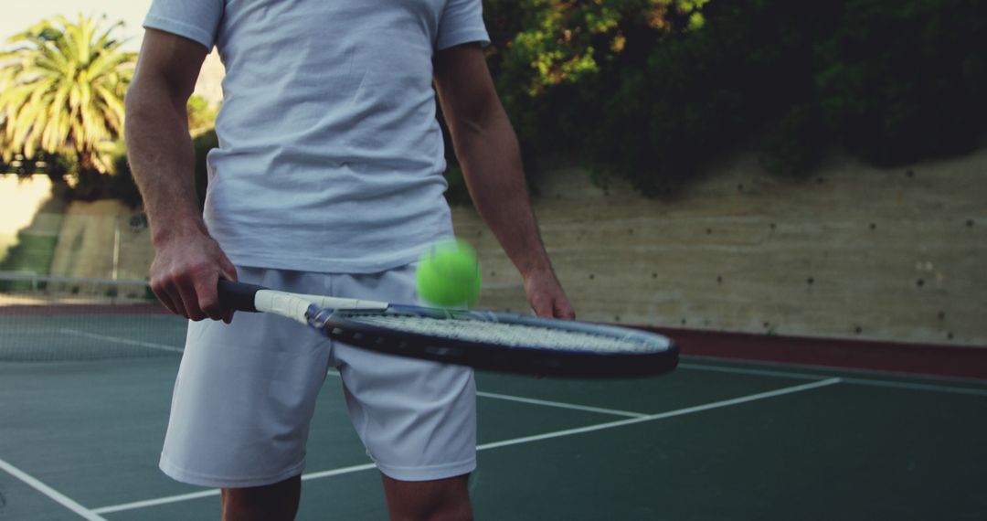 Young Adult Player Practicing Tennis Outdoors - Free Images, Stock Photos and Pictures on Pikwizard.com