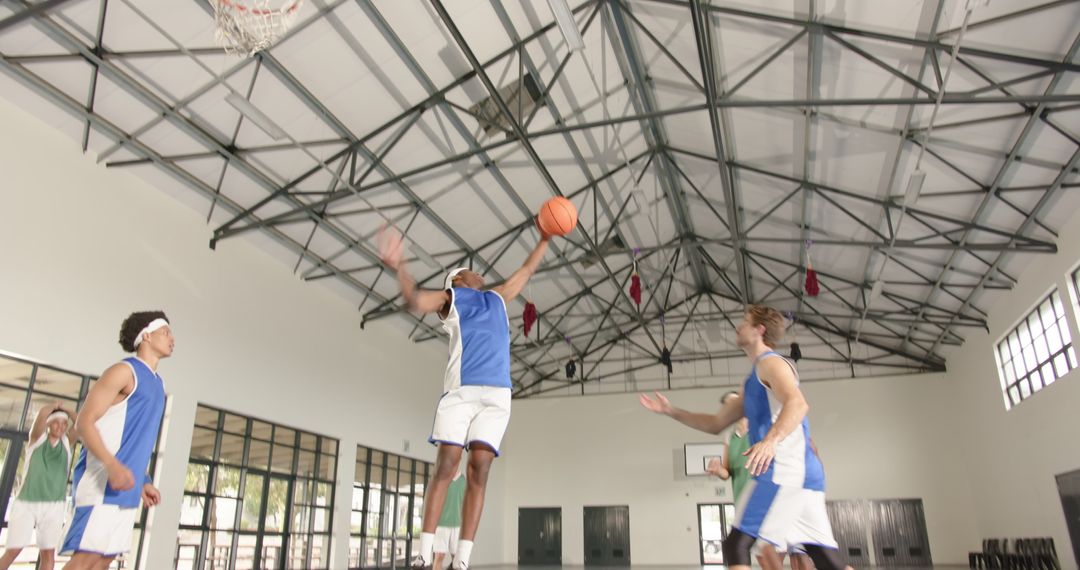 Dynamic Basketball Game Action Indoors Showcasing Teamwork