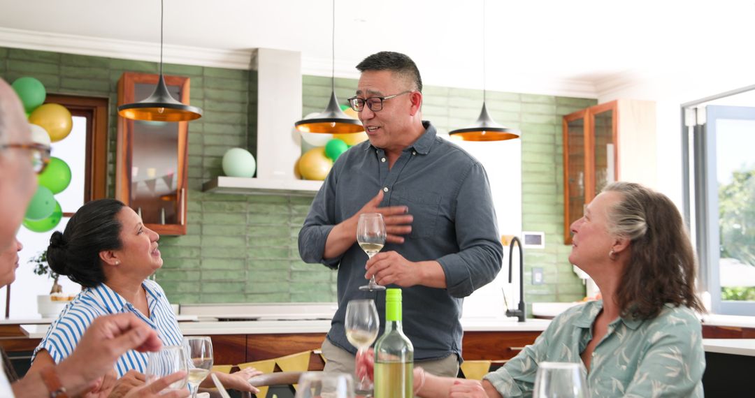 Senior Man Toasting Among Friends at Intimate Gathering