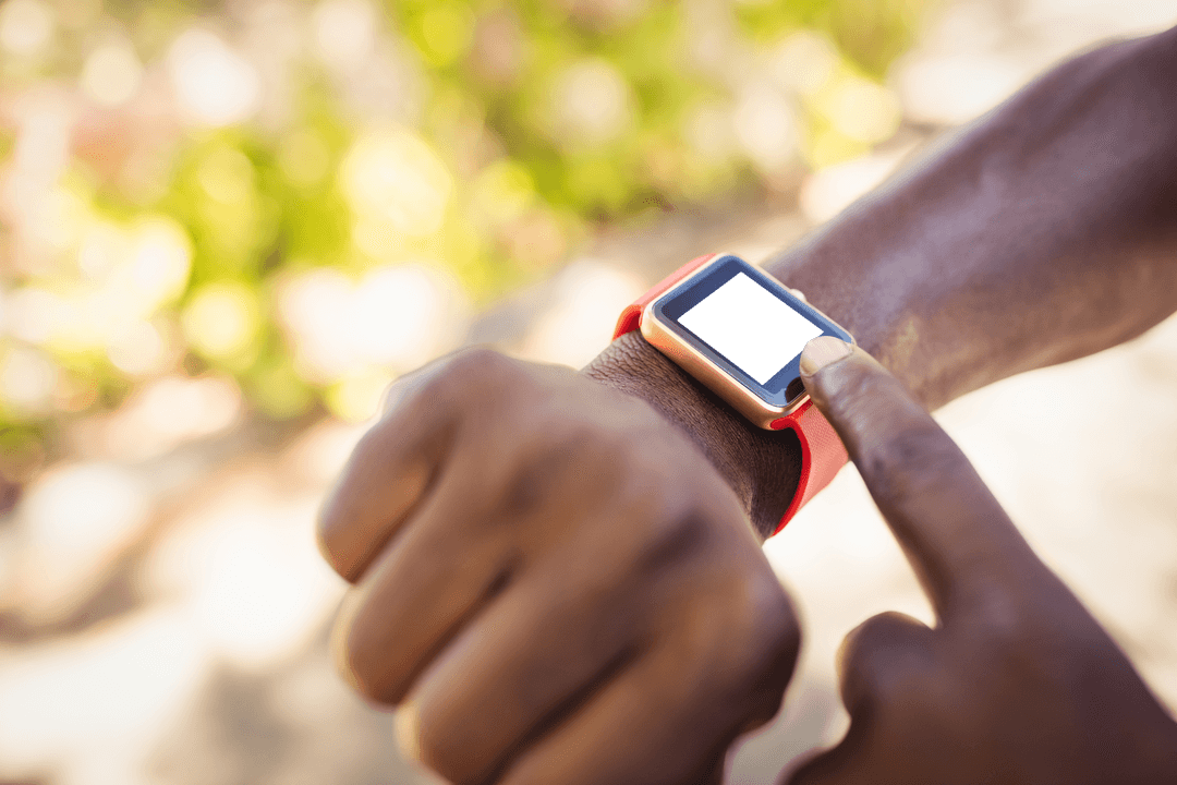 Person Interacting with Transparent Smartwatch Outdoors