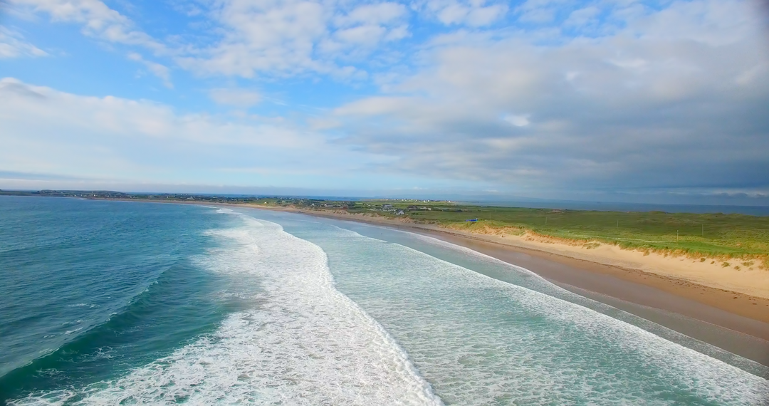 Transparent Blue Ocean Waves Crashing onto Sandy Shore Under Cloudy Sky - Download Free Stock Images Pikwizard.com