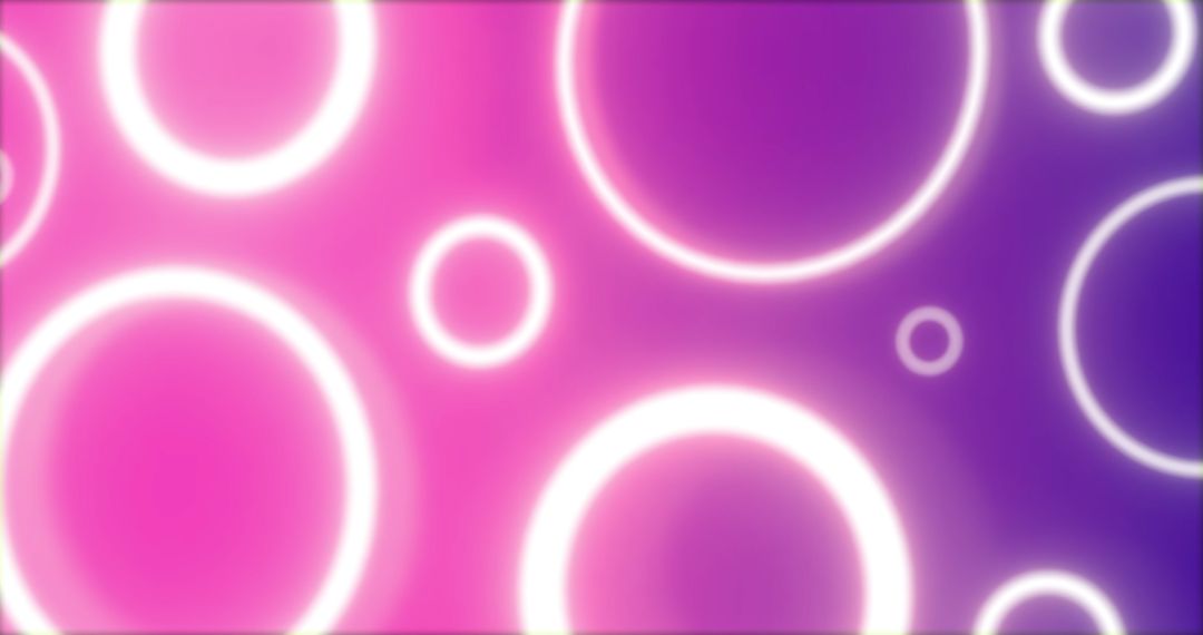 Pulsating Neon Rings on Pink and Purple Gradient Backdrop