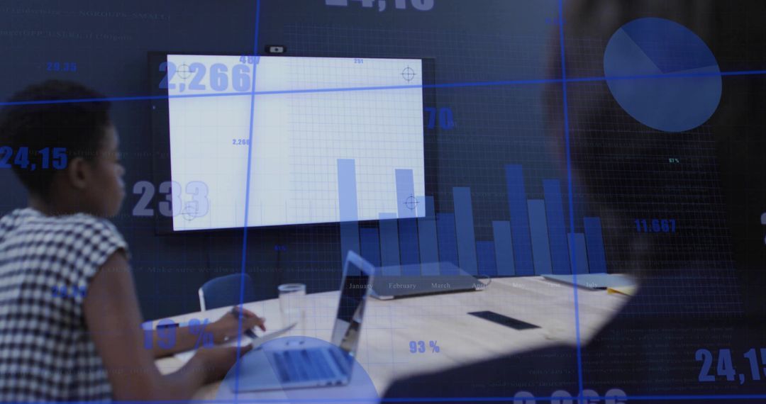 Professional Team Analyzing Data with Digital Interface Graphics