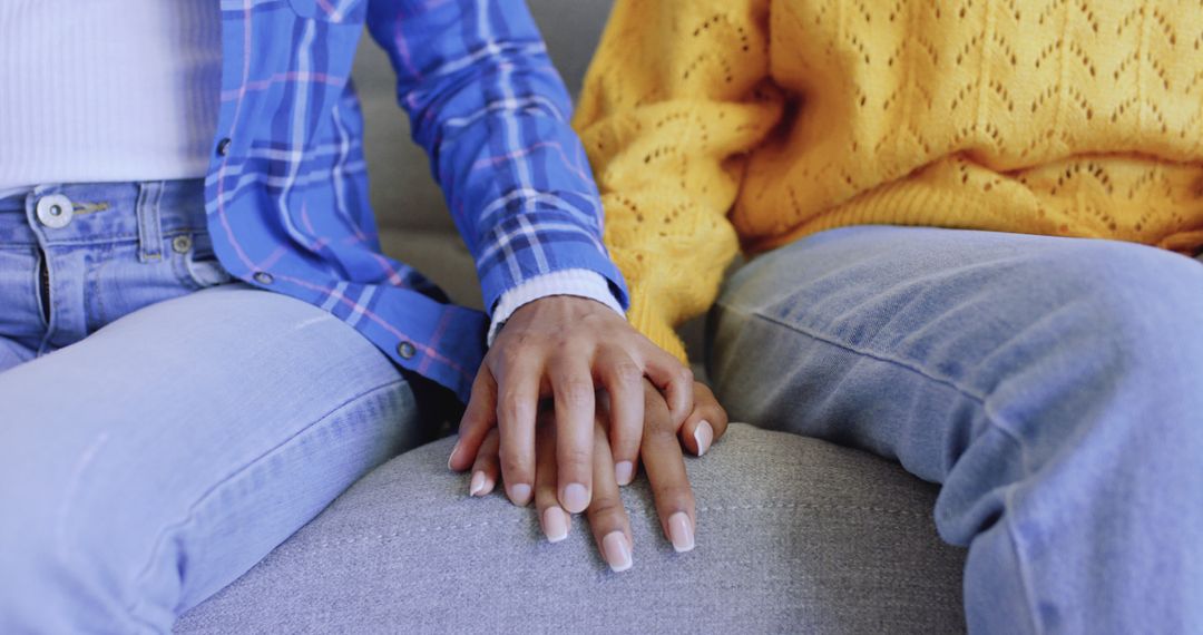 Close-up of People Holding Hands on Sofa Wearing Casual Clothes - Free Images, Stock Photos and Pictures on Pikwizard.com