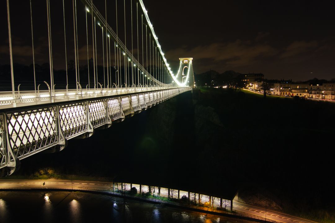 Illuminated Suspension Bridge Over River at Night - Free Images, Stock Photos and Pictures on Pikwizard.com