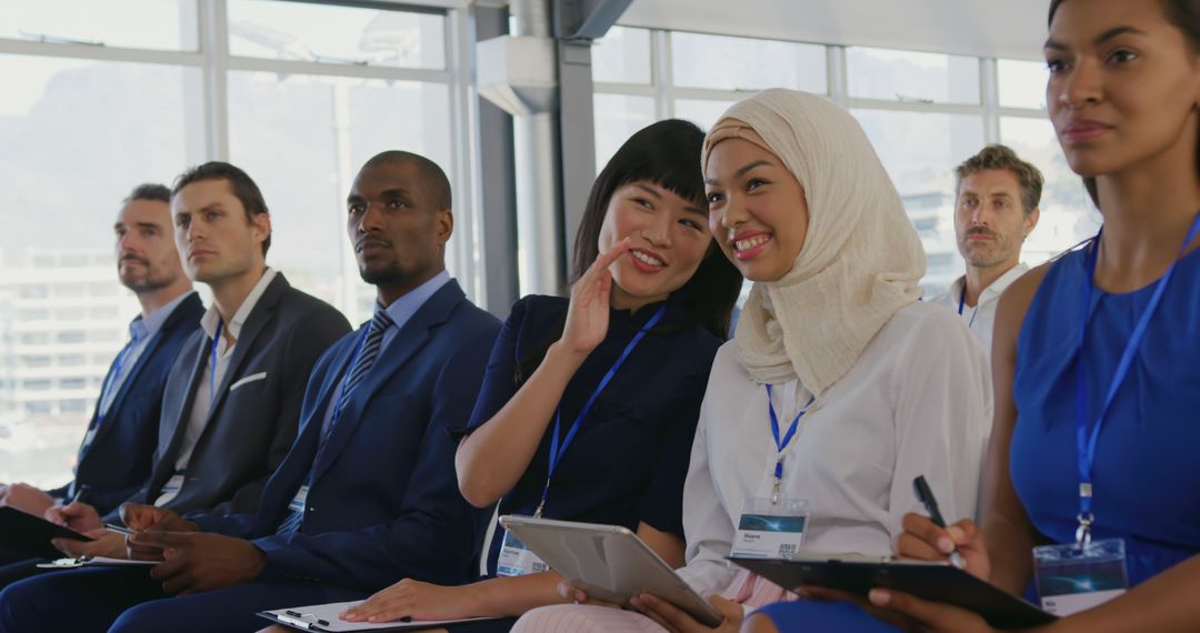 Diverse Business Seminar Audience Engaging with Presenters