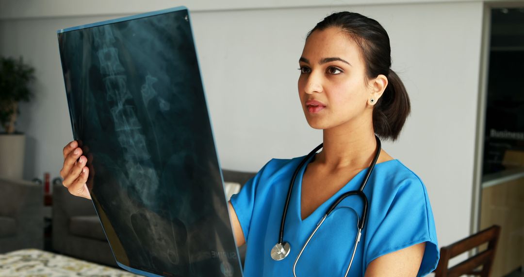 Female Doctor Analyzing X-ray in Clinic - Free Images, Stock Photos and Pictures on Pikwizard.com