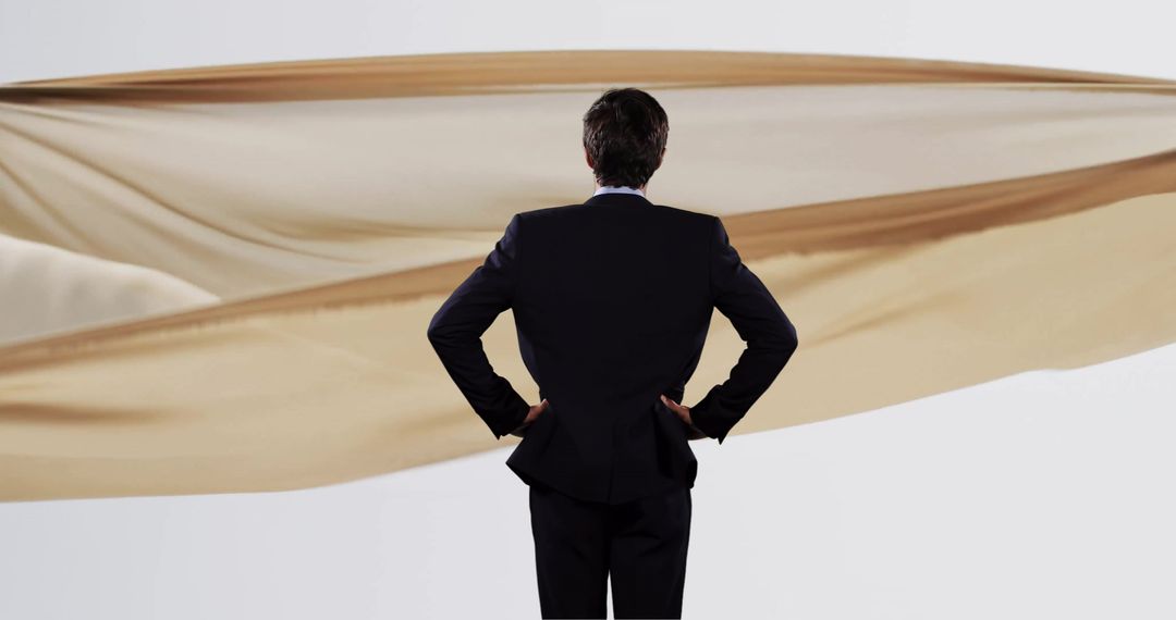 Businessman Contemplating Floating Cloth Display