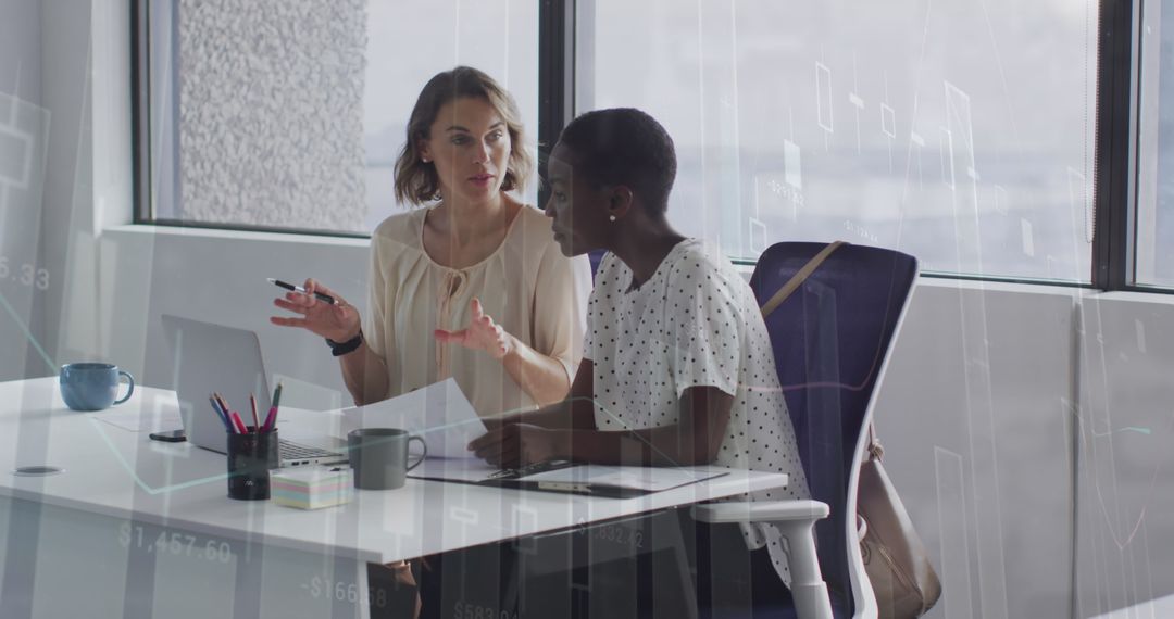 Colleagues Discussing Financial Strategy in Modern Office Environment