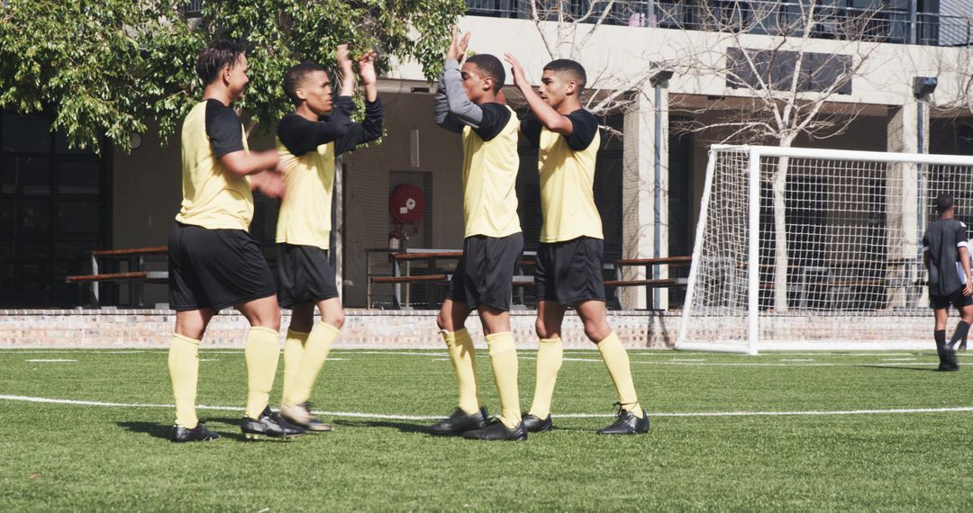 Soccer Team Practicing for Upcoming Match on Sunny Day