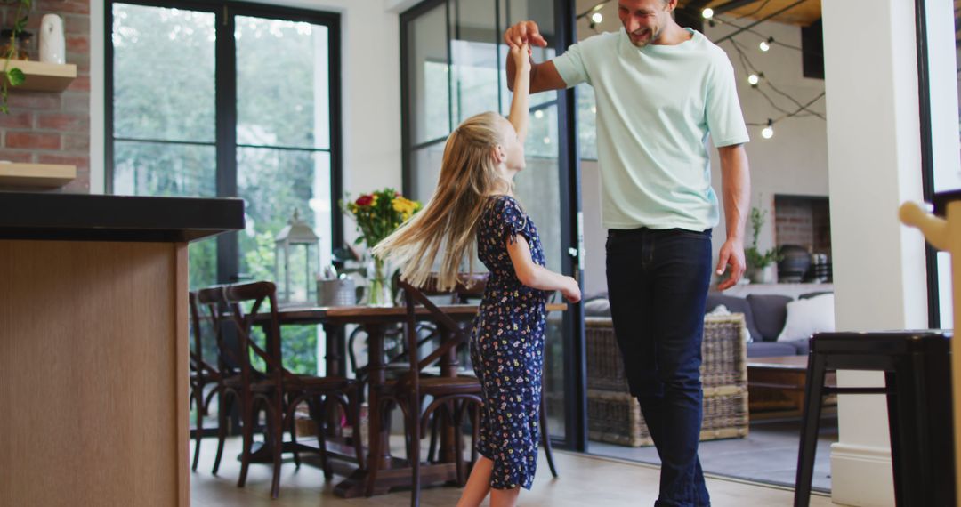 Father and Daughter Dancing Together in Modern Home - Free Images, Stock Photos and Pictures on Pikwizard.com