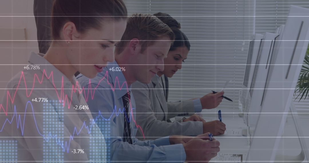 Diverse Business Team Analyzing Data in Office Setting