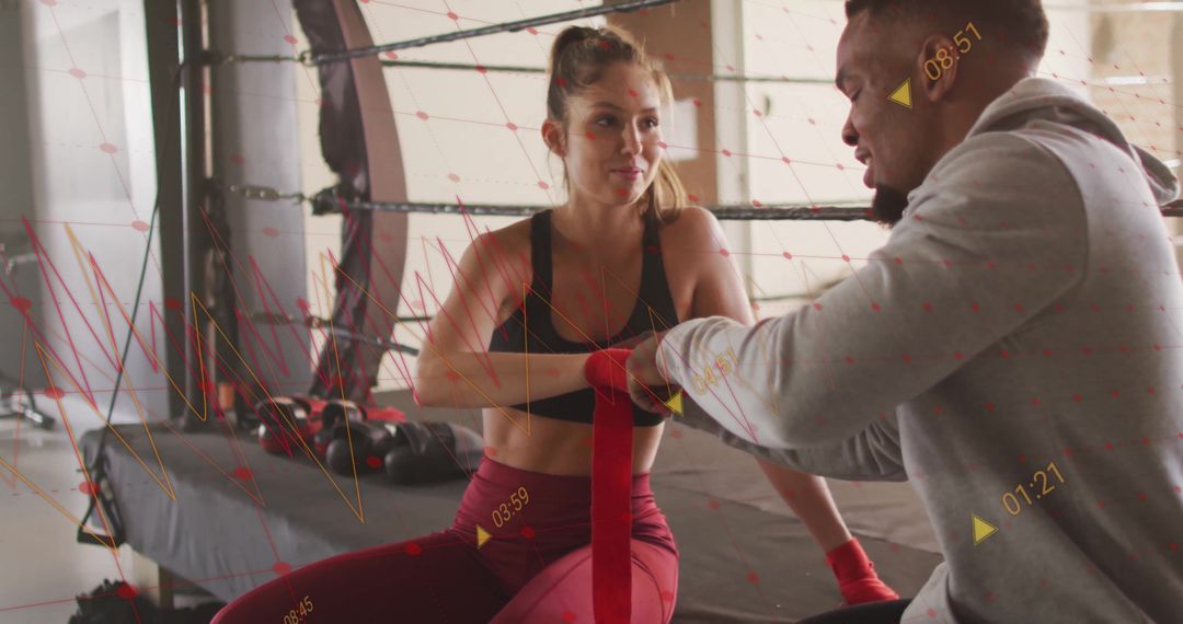 Athletes Wrapping Hands with Boxing Training Data Overlay