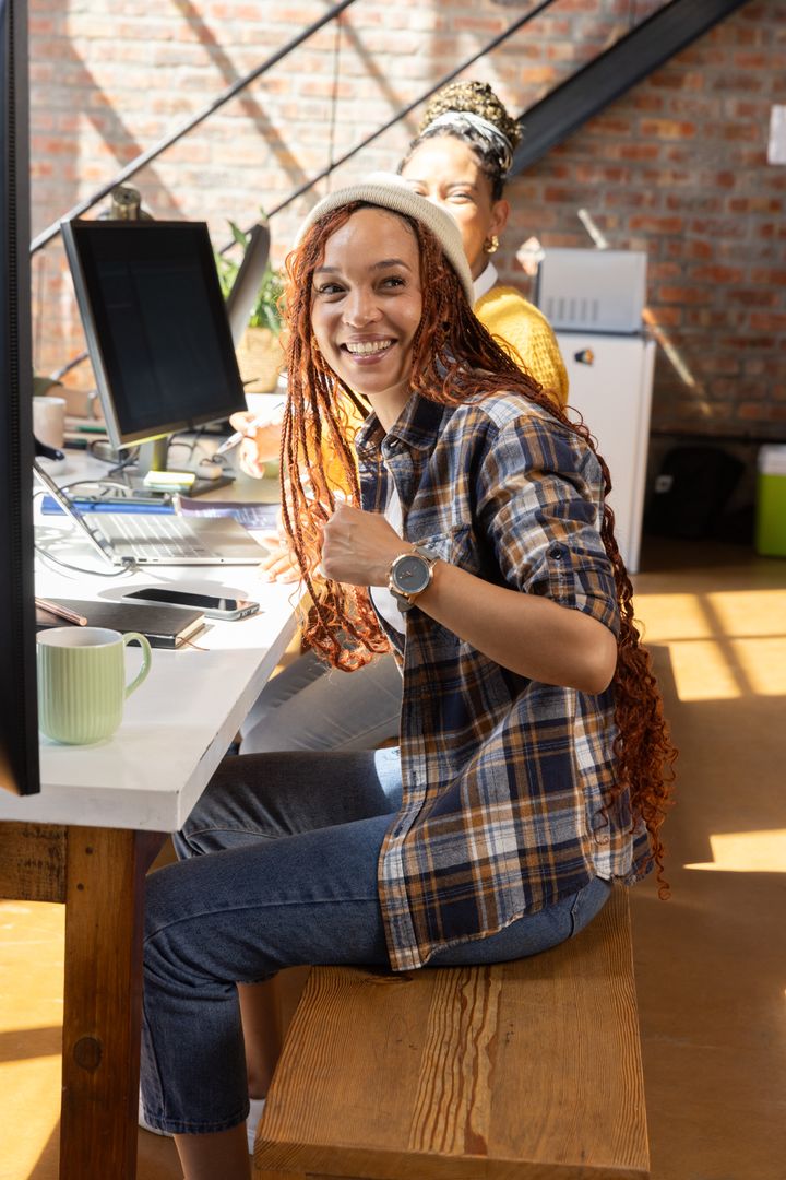 Smiling Coworkers Enjoying Teamwork in Modern Office Environment