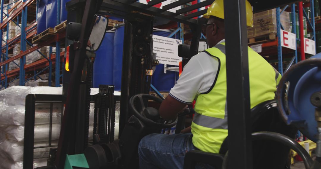 Worker Operating Forklift in Warehouse with Safety Gear - Free Images, Stock Photos and Pictures on Pikwizard.com