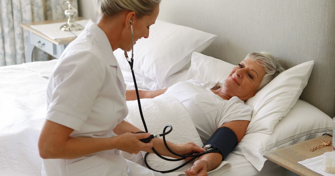 Healthcare Professional Checking Blood Pressure of Elderly Patient - Free Images, Stock Photos and Pictures on Pikwizard.com