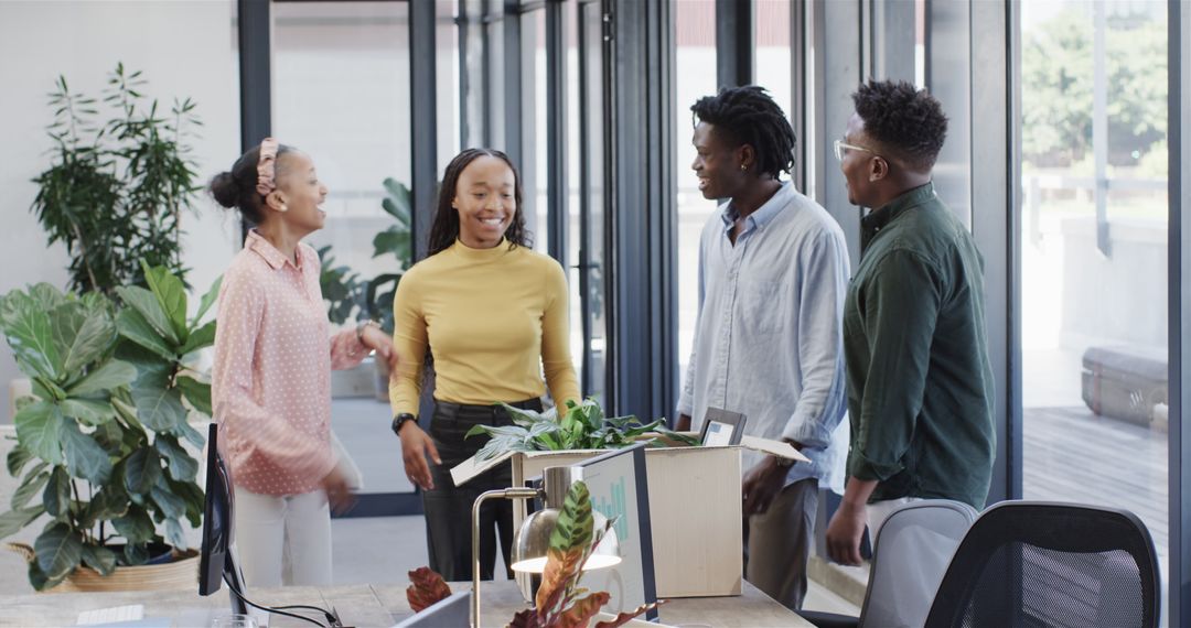 Diverse Team in Modern Office Engaging in Collaborative Discussion